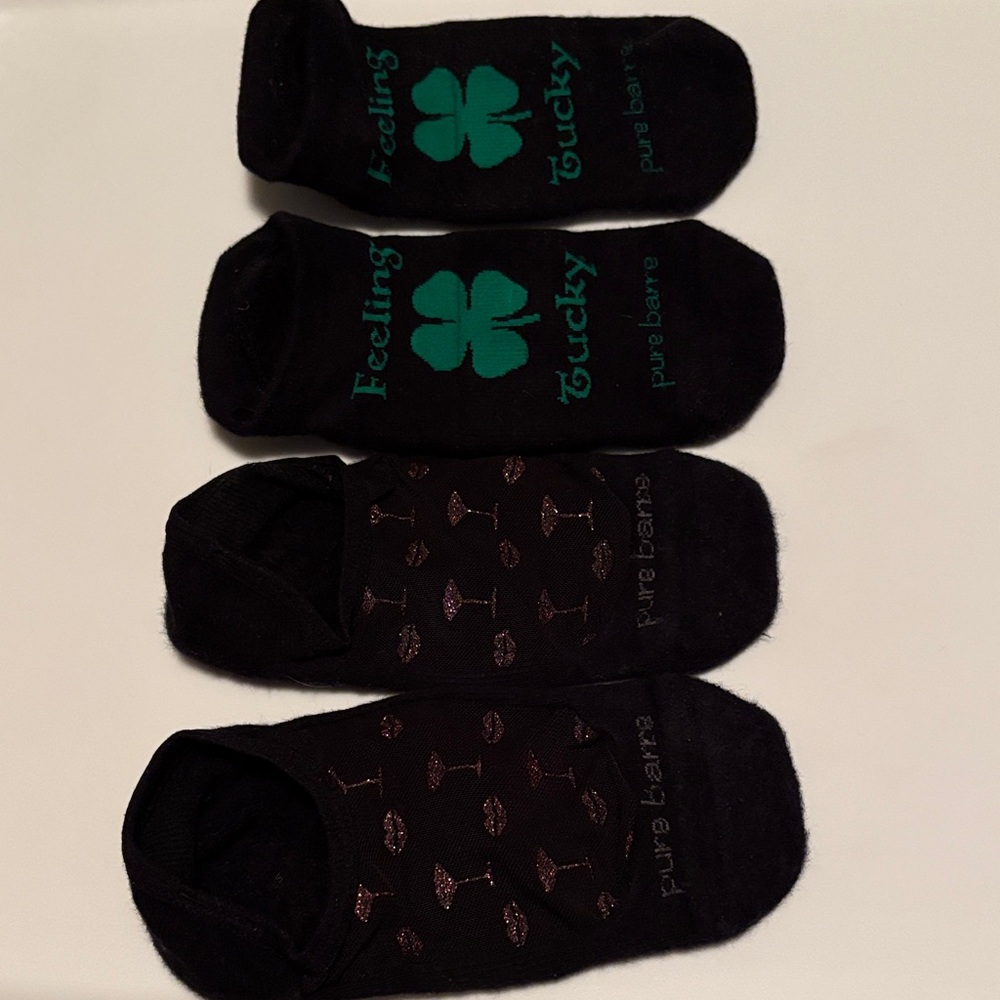 Pure Barre Socks. 1 has “Feeling Tucky” and 1 has glitter lips & glass